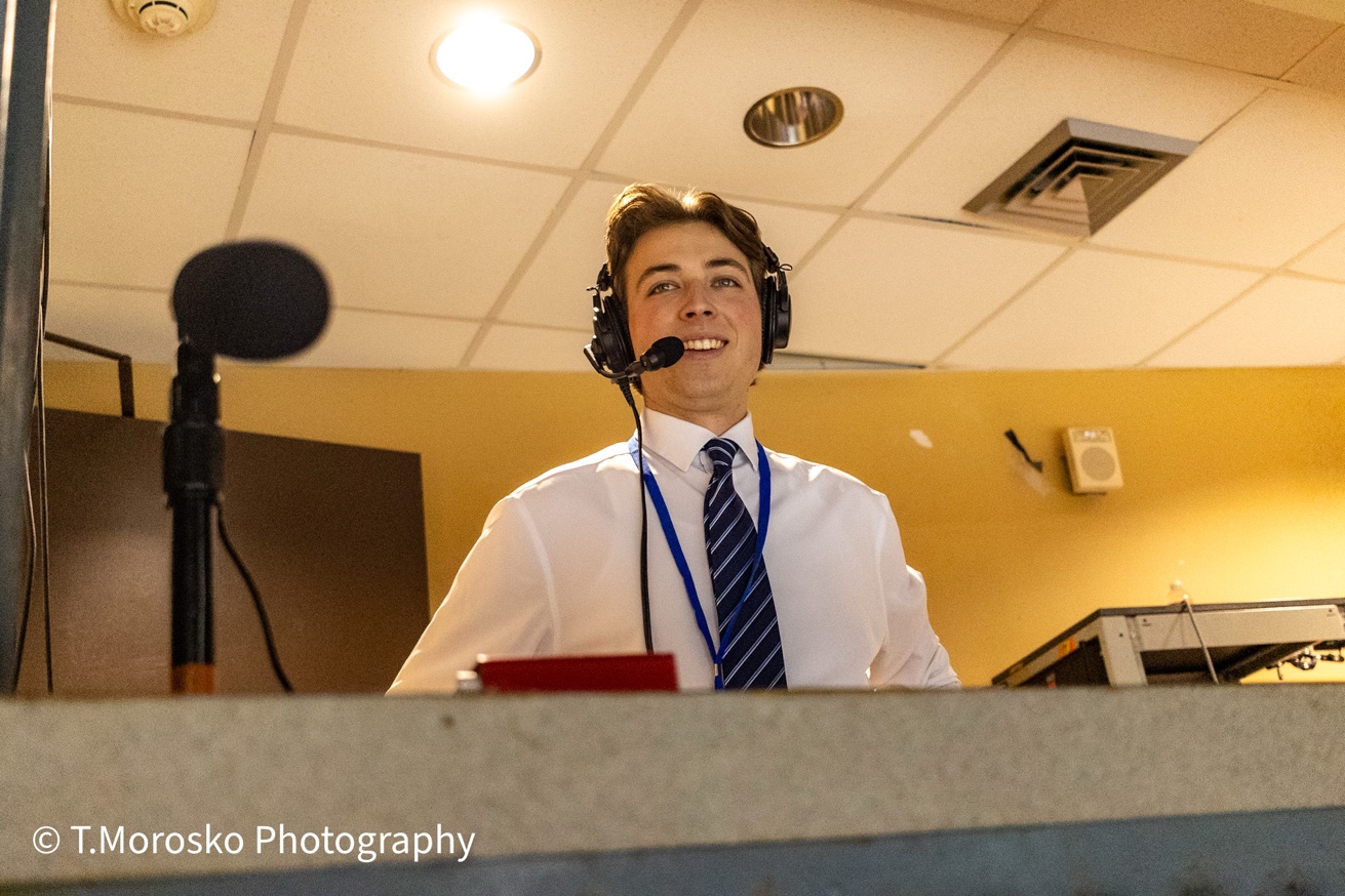 Devin Dobek in the professional broadcast booth, 2025